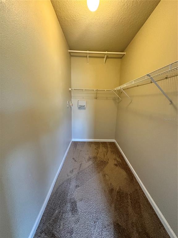 8849 Villa View Circle, Unit 306 Orlando, FL 32821 - Photo 7 of 15 a view of a room with empty racks