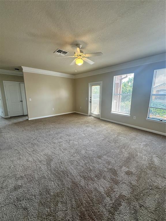 8849 Villa View Circle, Unit 306 Orlando, FL 32821 - Photo 9 of 15 an empty room with windows and ceiling fan
