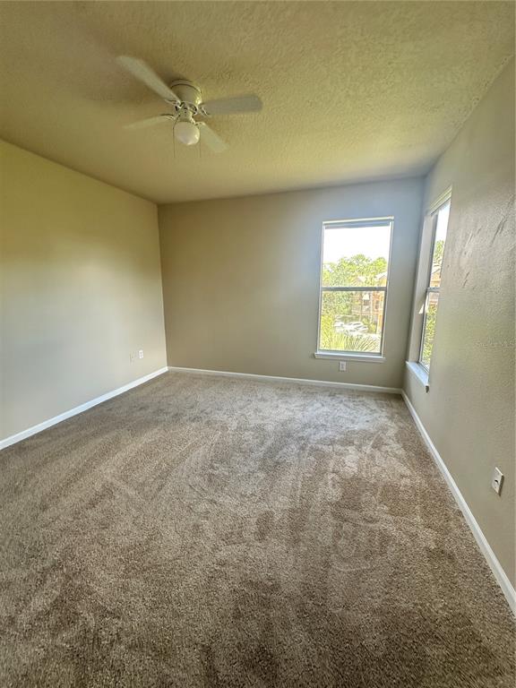 8849 Villa View Circle, Unit 306 Orlando, FL 32821 - Photo 10 of 15 an empty room with a window