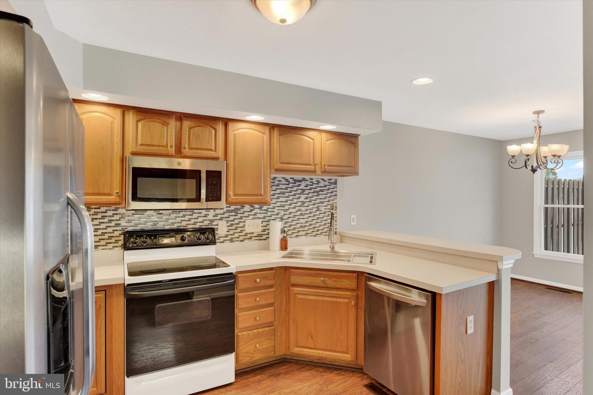 1041 Memory Lane Harrisburg, PA 17111 - Photo 5 of 31 a kitchen with a sink stove and microwave