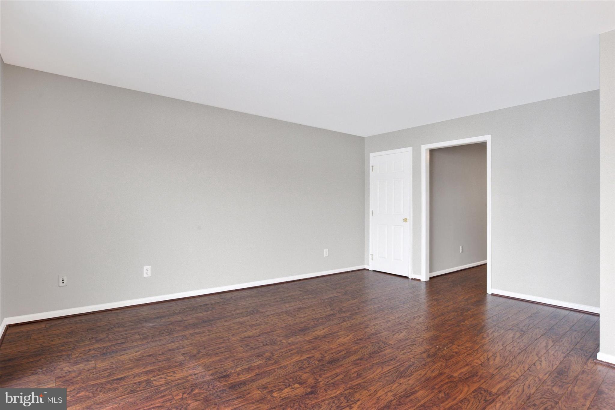 1041 Memory Lane Harrisburg, PA 17111 - Photo 9 of 31 a view of an empty room with wooden floor and closet