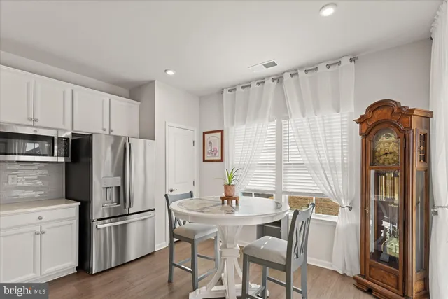 a dining room with a table and chairs