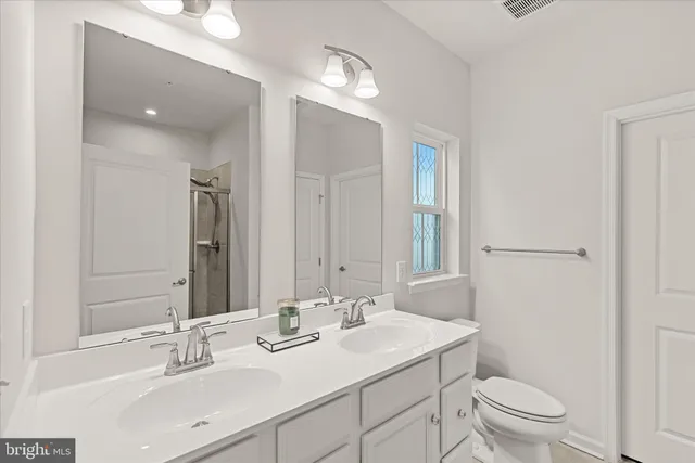 a bathroom with a sink and shower