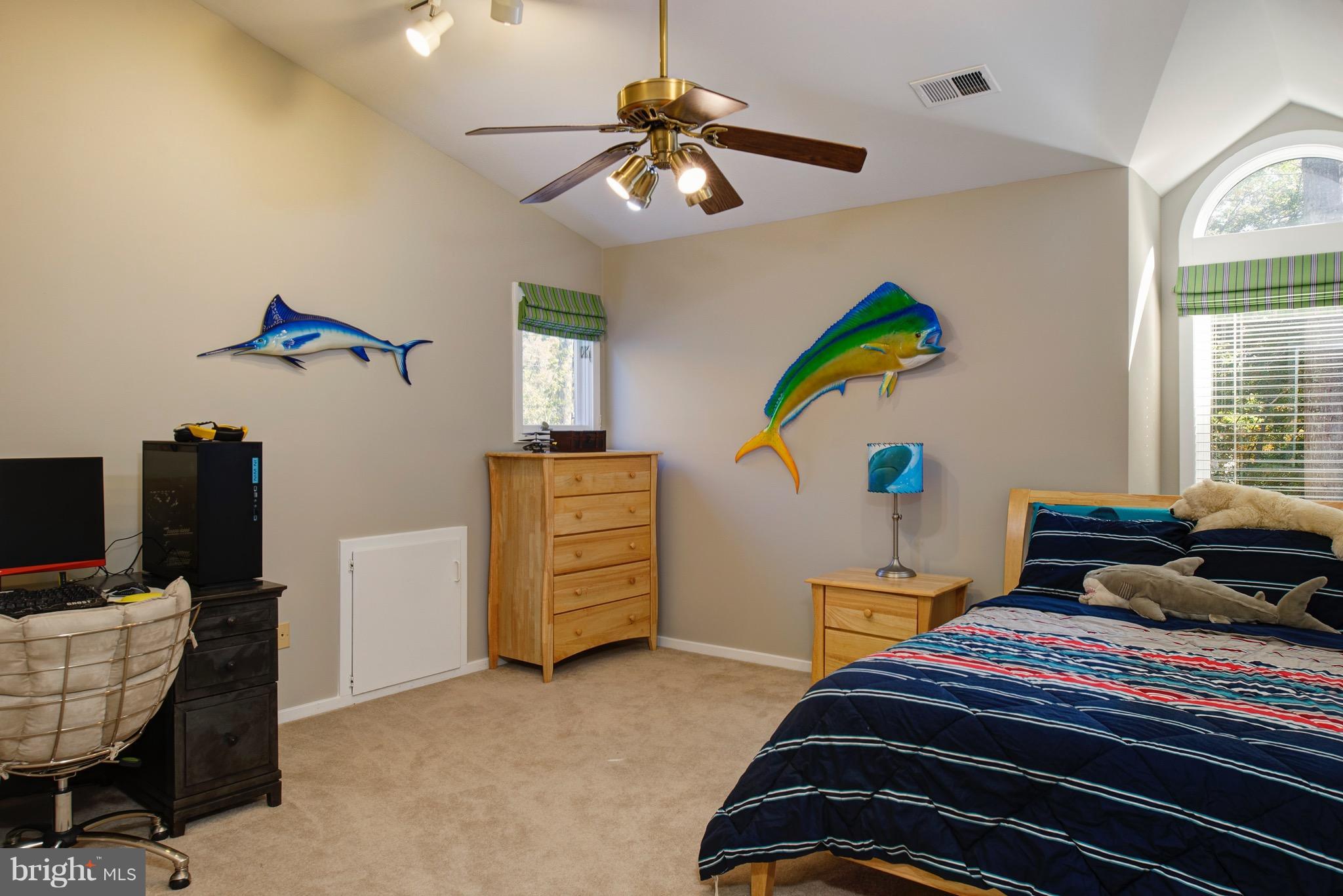 11400 Fieldstone Lane Reston, VA 20191 - Photo 19 of 28 a bedroom with a bed and a chandelier