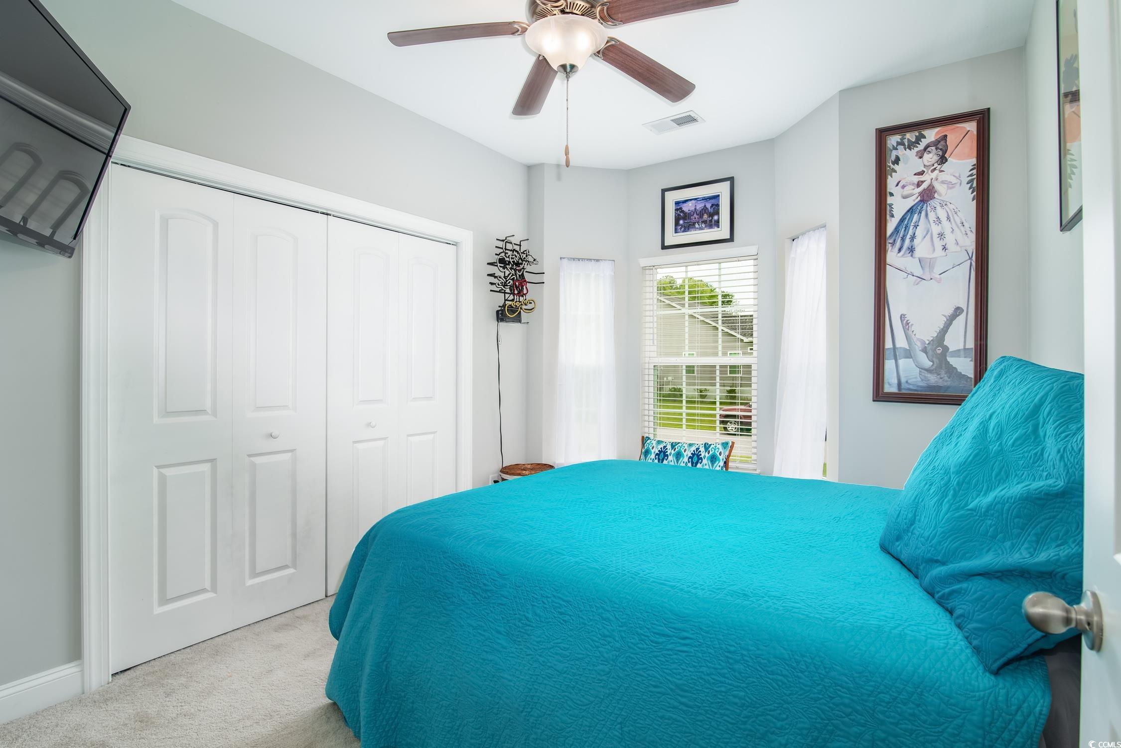 2242 Brier Street Georgetown, SC 29440 - Photo 12 of 29 Carpeted bedroom featuring ceiling fan and a close