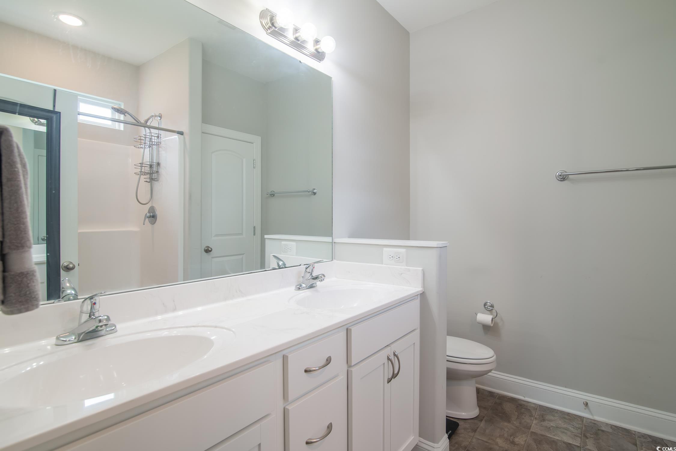 2242 Brier Street Georgetown, SC 29440 - Photo 17 of 29 Bathroom featuring toilet, tile patterned flooring