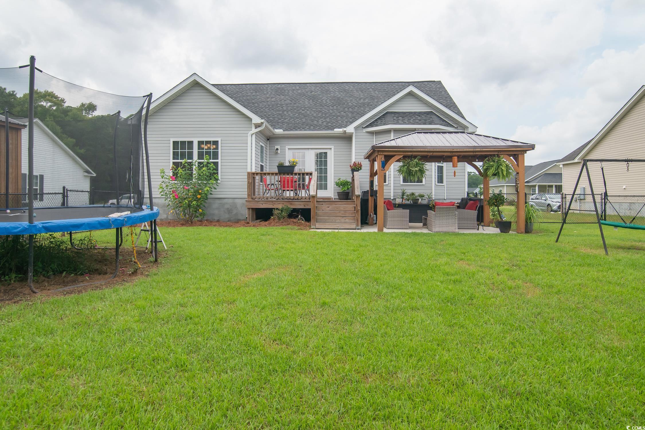 2242 Brier Street Georgetown, SC 29440 - Photo 19 of 29 Rear view of property with a lawn, a gazebo, a tra