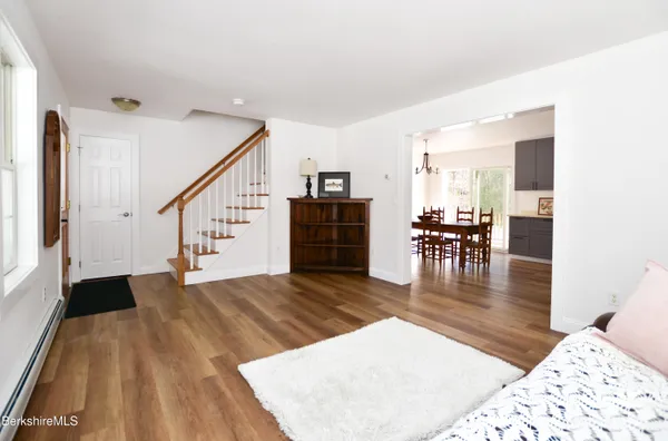 a view of livingroom and dining room with wooden floor