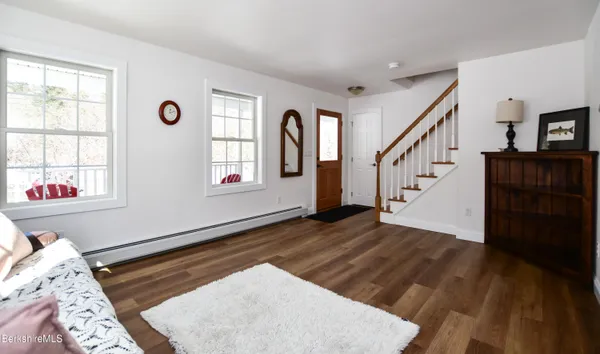 a view of entryway with wooden floor
