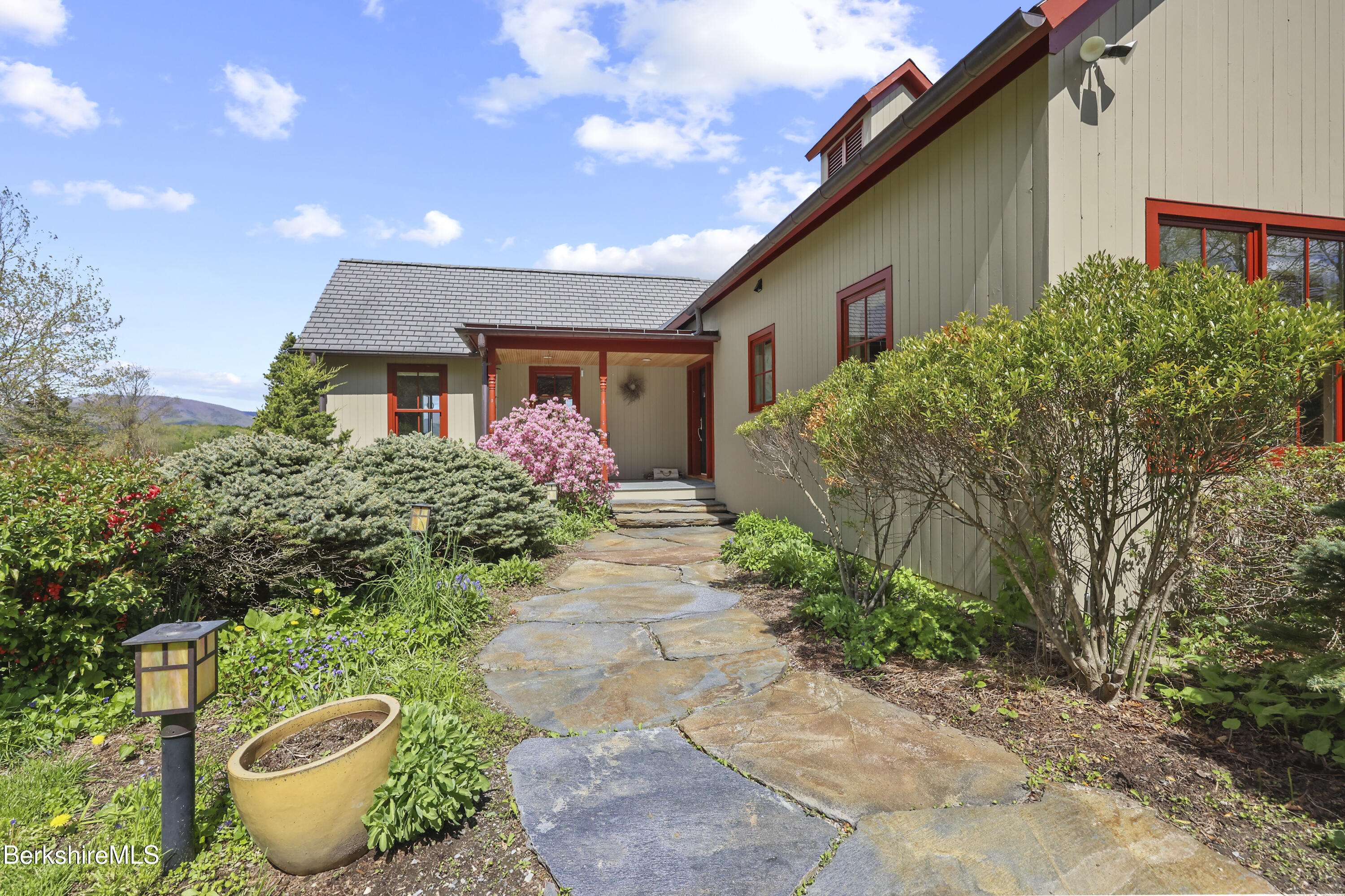 821 Pattison Road North Adams, MA 01247 - Photo 5 of 68 a front view of a house with potted plants
