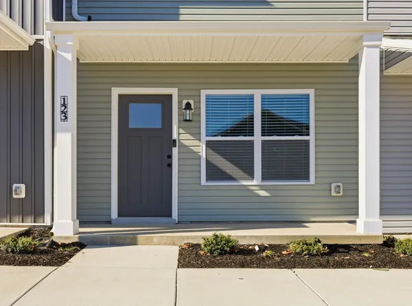 a front view of a house with a garage