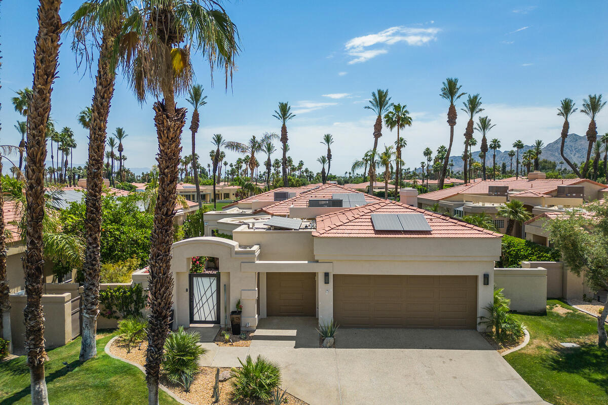 a picture of houses with palm trees
