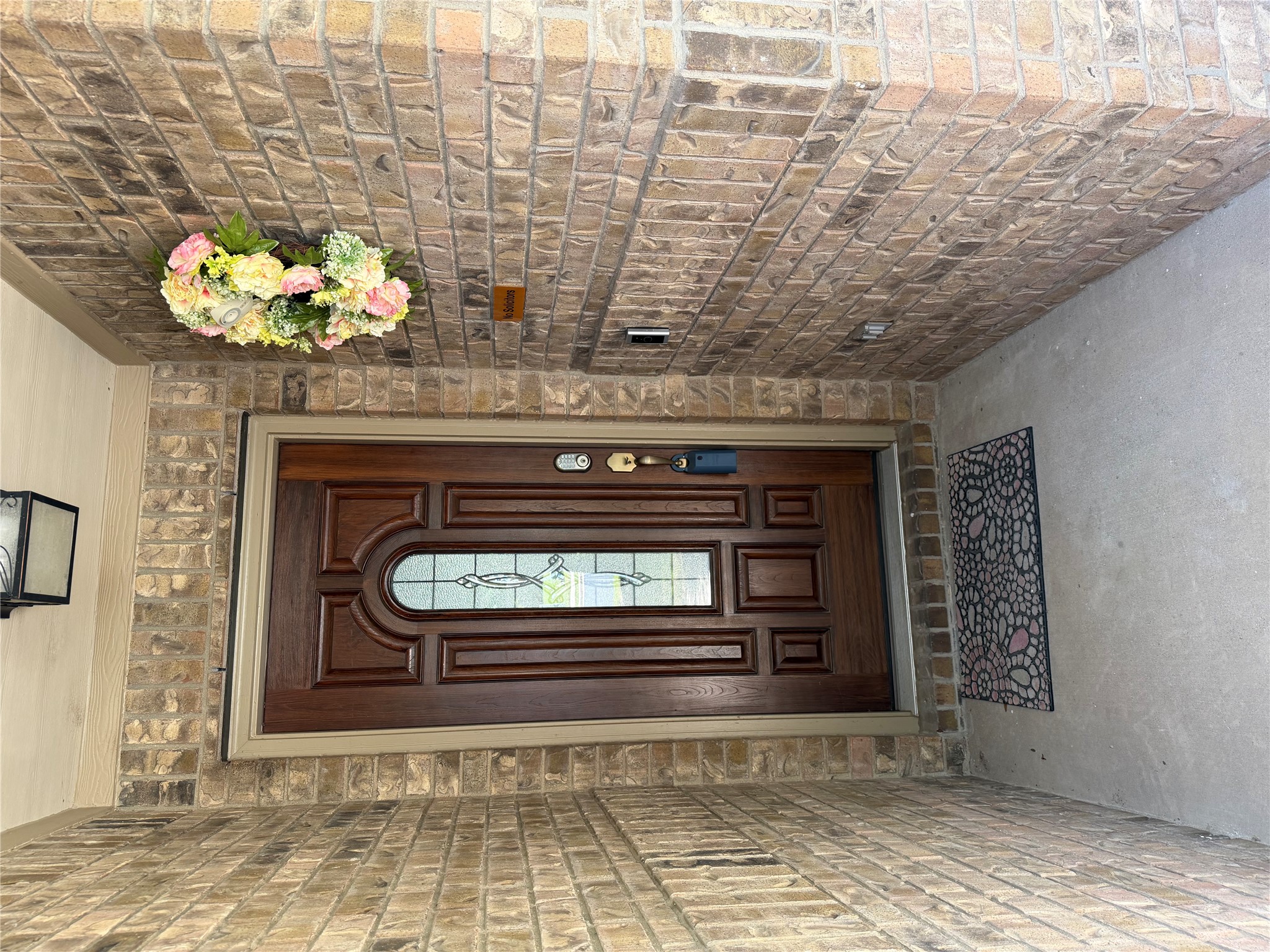 112 Eagle Owl Loop Leander, TX 78641 - Photo 2 of 35 Welcome guests with a richly paneled entry door, complete with decorative glass, set into an inviting brick facade.