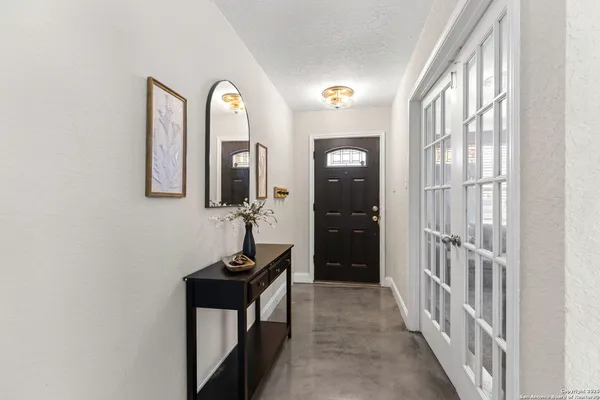 a view of a hallway with front door