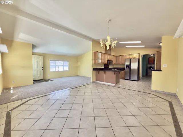a view of a kitchen with a sink and cabinets