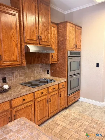 a view of a dining room with furniture and window