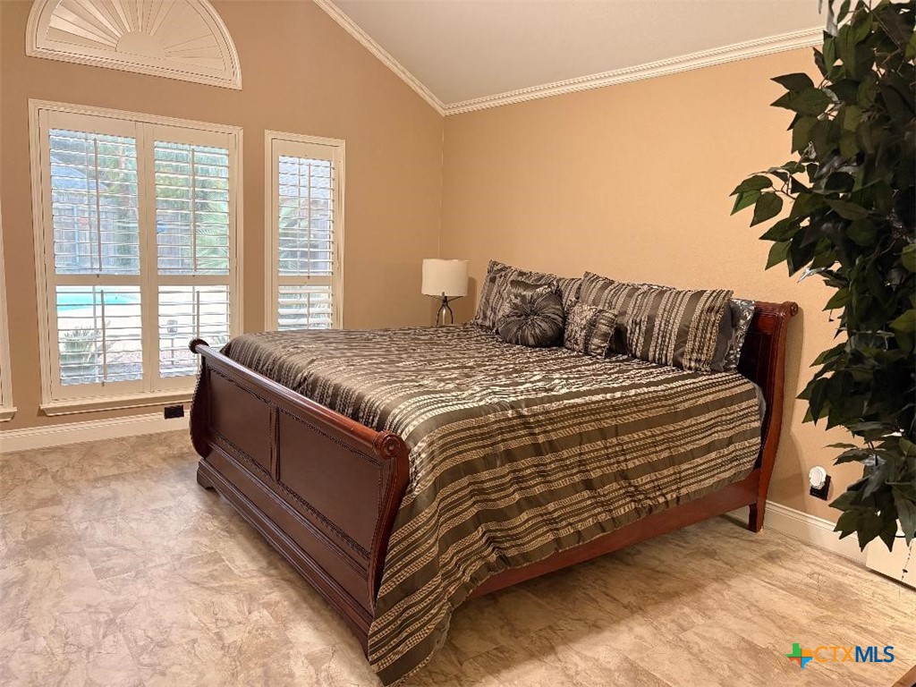 116 Northampton Circle Victoria, TX 77904 - Photo 8 of 13 a bed sitting in a spacious bedroom next to a window