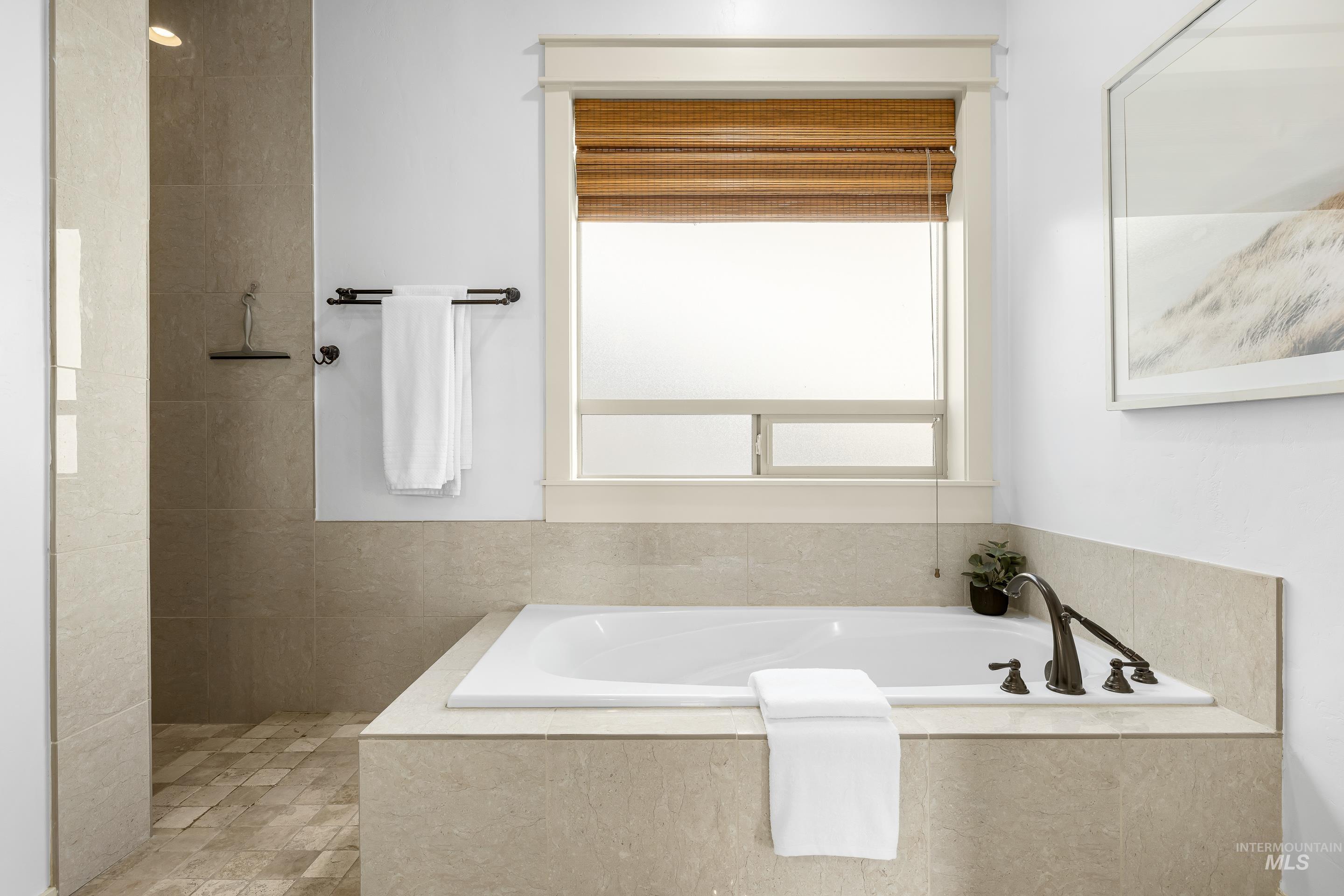 7521 North Grand Ridge Lane Eagle, ID 83616 - Photo 35 of 50 Bathroom featuring a garden tub and walk in shower
