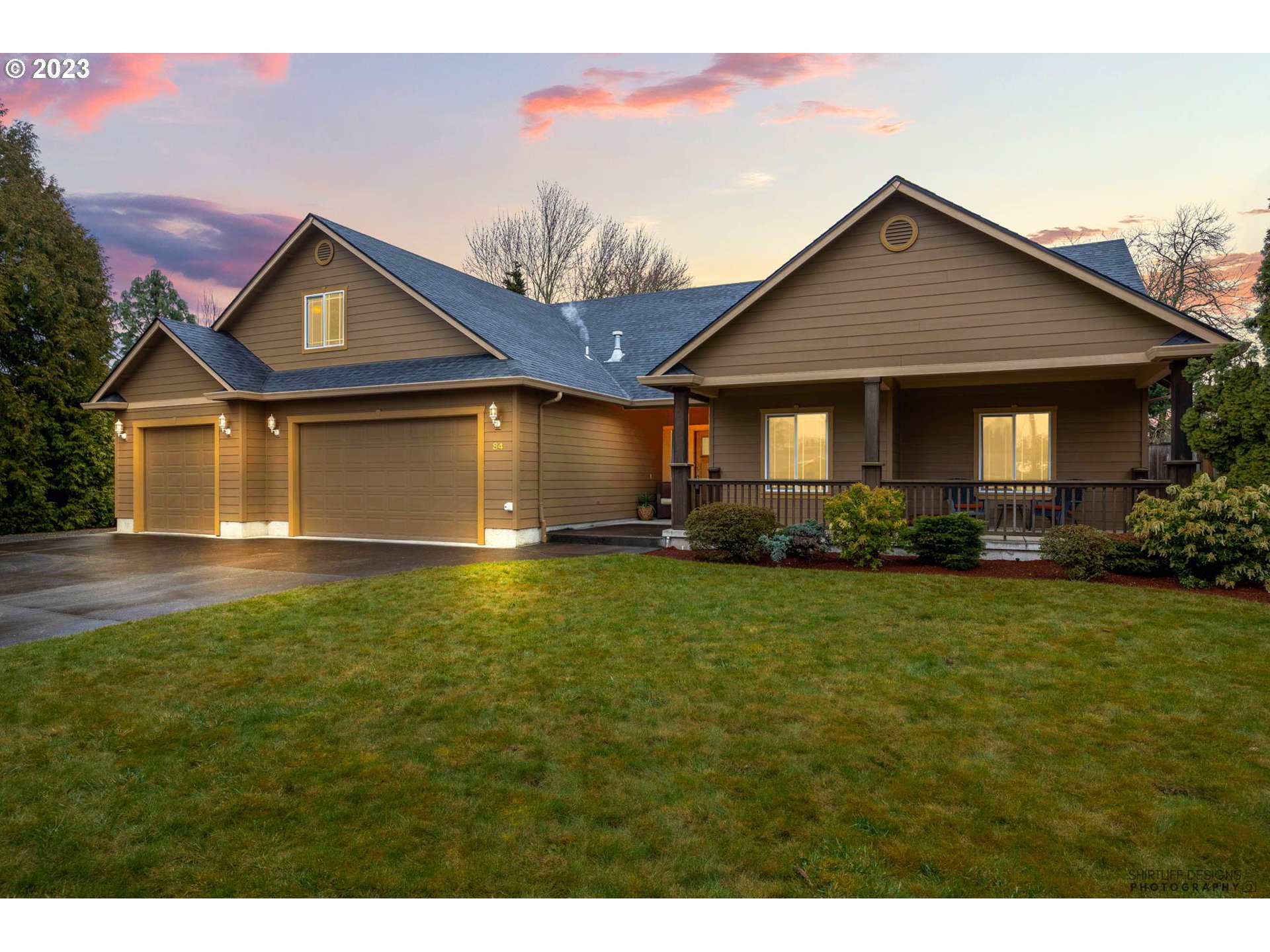a front view of house with yard and green space