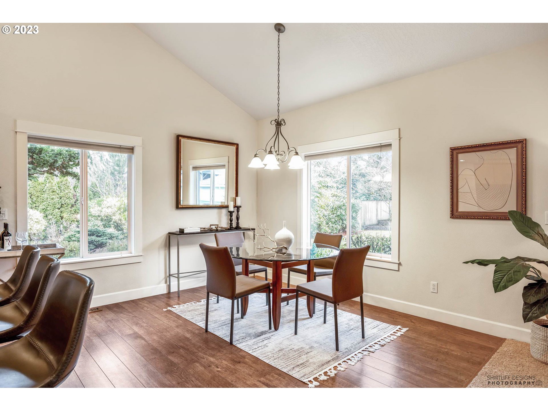 84 Federal Lane Eugene, OR 97404 - Photo 11 of 32 a dining room with furniture a chandelier and wooden floor