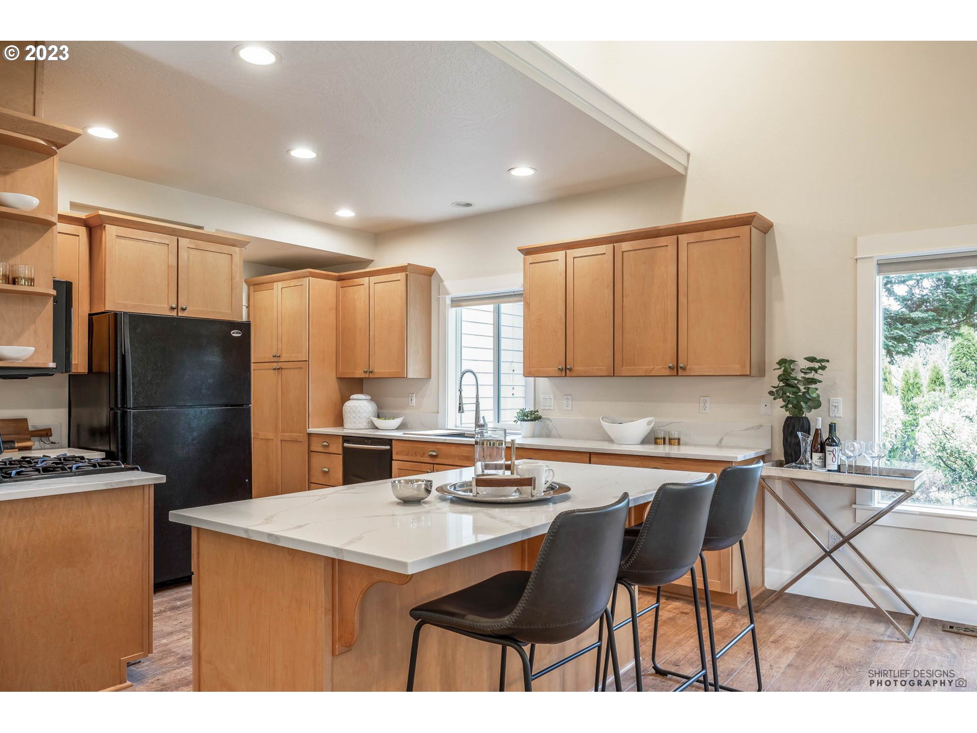 84 Federal Lane Eugene, OR 97404 - Photo 13 of 32 a kitchen with a sink a refrigerator and chairs