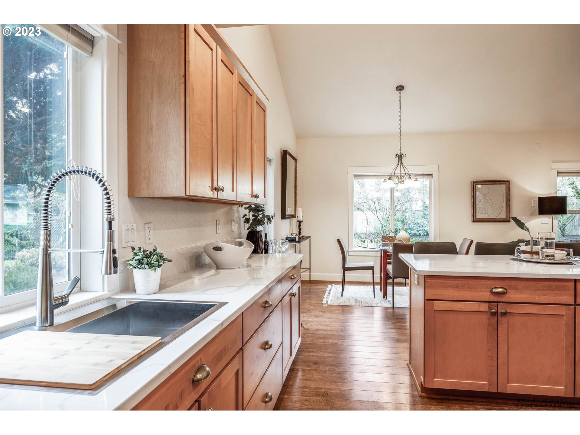 84 Federal Lane Eugene, OR 97404 - Photo 15 of 32 a kitchen with stainless steel appliances granite countertop a sink a stove and wooden floors