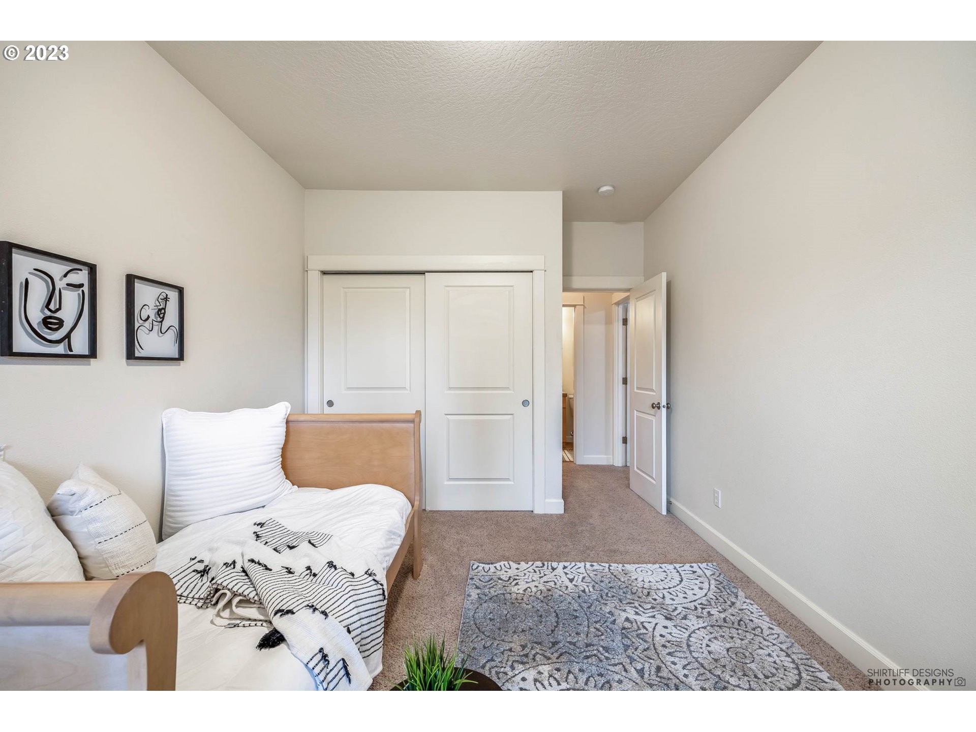 84 Federal Lane Eugene, OR 97404 - Photo 21 of 32 a bedroom with a bed and a couch