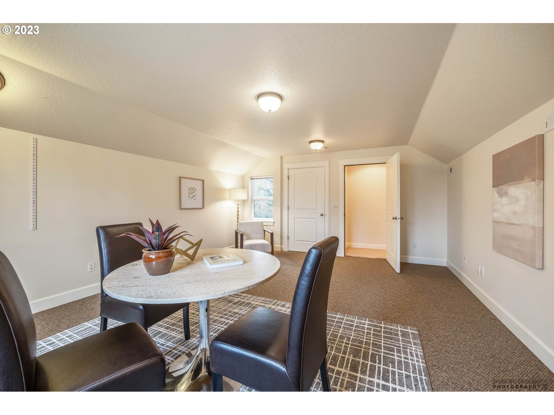 84 Federal Lane Eugene, OR 97404 - Photo 26 of 32 a view of a dining room with furniture and wooden floor