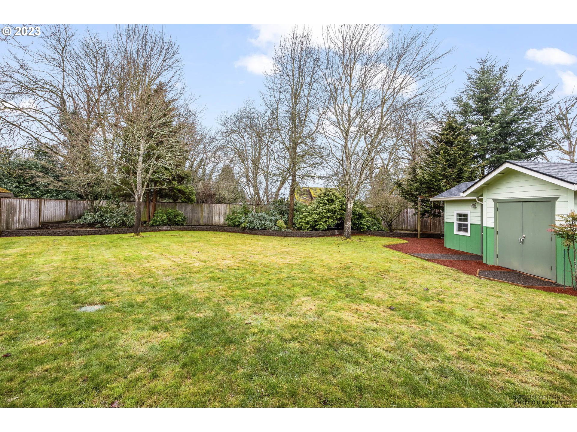 84 Federal Lane Eugene, OR 97404 - Photo 29 of 32 a view of a house with a yard
