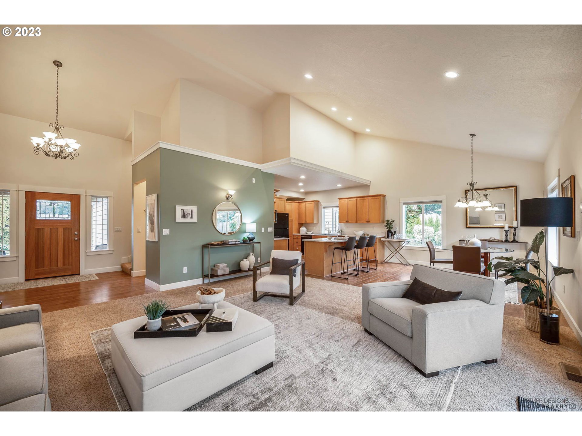 84 Federal Lane Eugene, OR 97404 - Photo 6 of 32 a living room with furniture and a chandelier