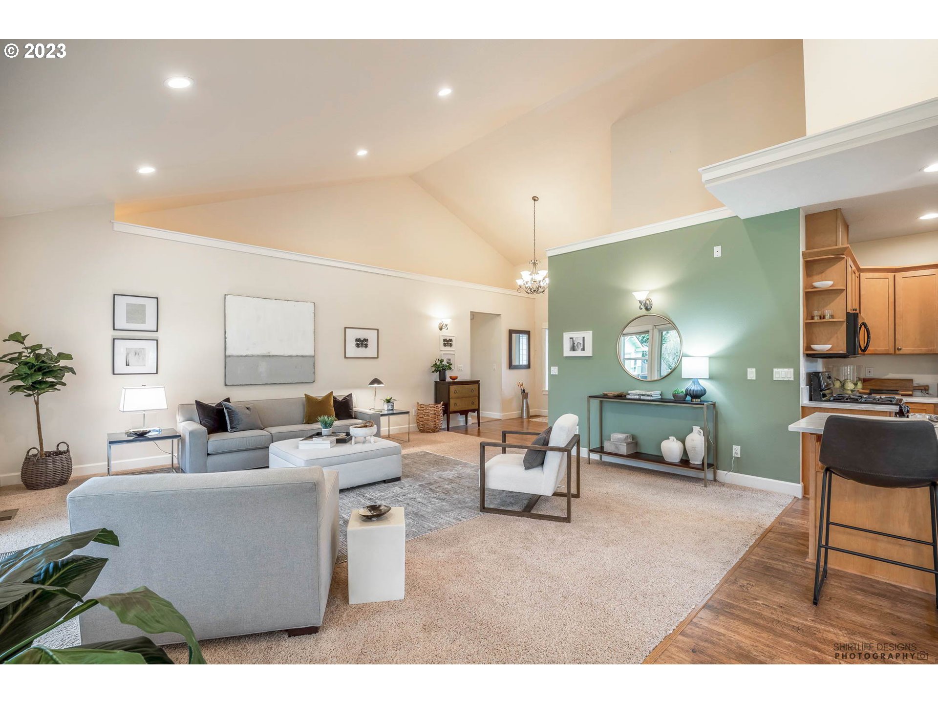 84 Federal Lane Eugene, OR 97404 - Photo 9 of 32 a living room with furniture a dining table and chairs with wooden floor