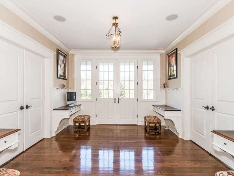 38 Hunting Ridge Lane Wilton, CT 06897 - Photo 11 of 25 a view of a livingroom with hardwood floor and a ceiling fan
