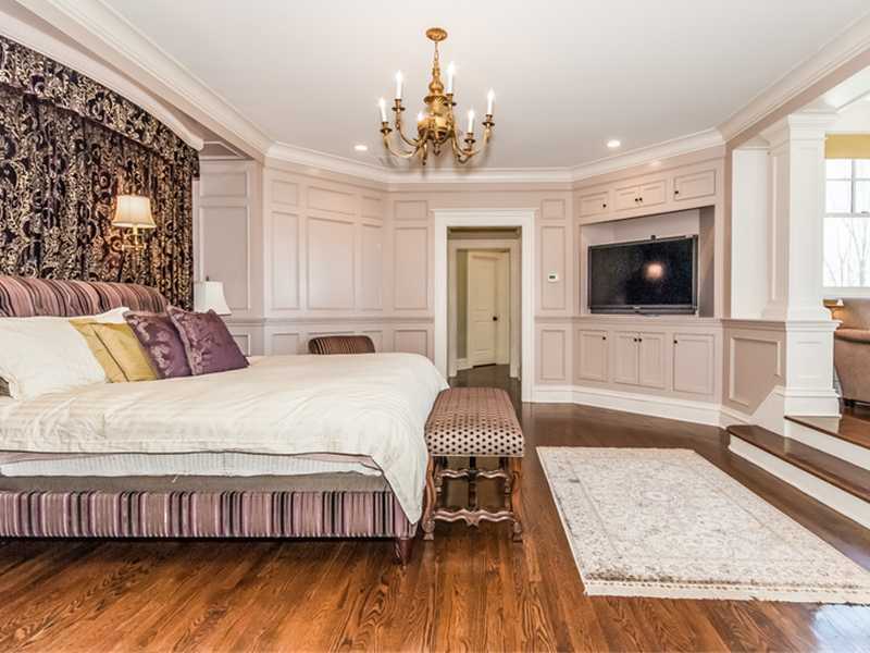 38 Hunting Ridge Lane Wilton, CT 06897 - Photo 20 of 25 a spacious bedroom with a bed and a flat screen tv