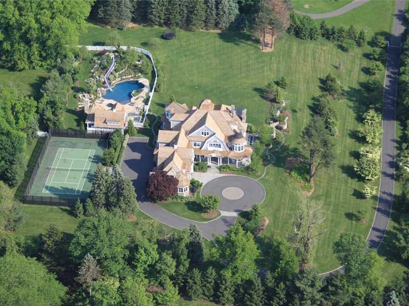 38 Hunting Ridge Lane Wilton, CT 06897 - Photo 2 of 25 an aerial view of a house with outdoor space and lake view