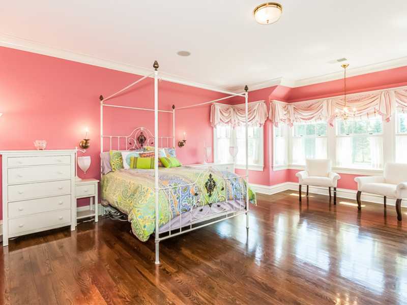 38 Hunting Ridge Lane Wilton, CT 06897 - Photo 23 of 25 a bed room with a bed window and a chair