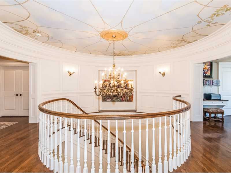 38 Hunting Ridge Lane Wilton, CT 06897 - Photo 25 of 25 a view of a hallway and a chandelier