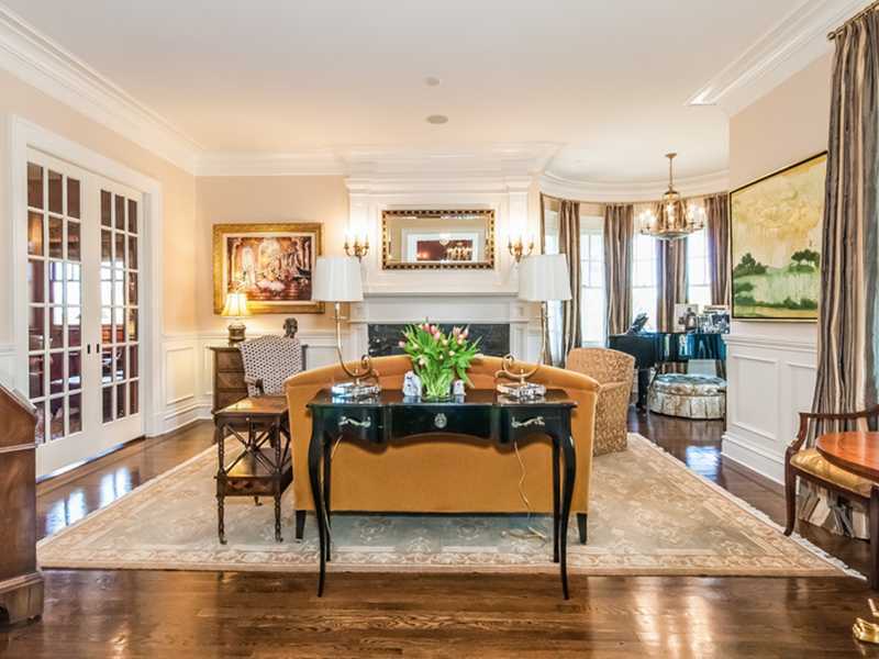 38 Hunting Ridge Lane Wilton, CT 06897 - Photo 5 of 25 a living room with furniture and a floor to ceiling window