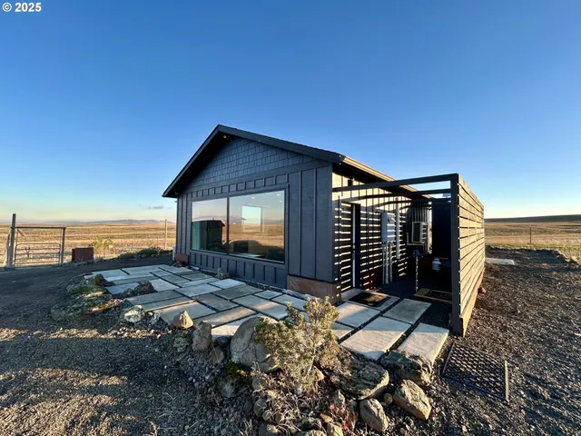 a backyard of a house with a yard