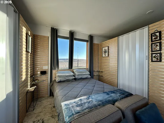 a en suite bathroom with a granite countertop sink and a mirror