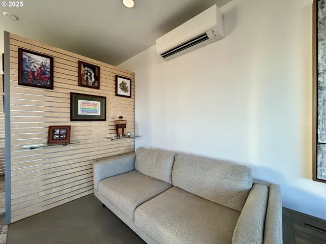 a kitchen with stainless steel appliances granite countertop a refrigerator a stove a sink a microwave and a refrigerator