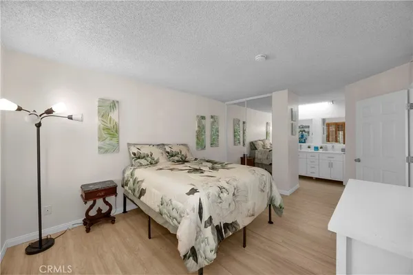 a bedroom with a bed and a table