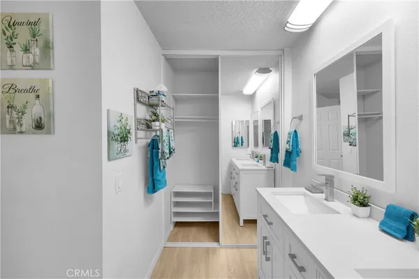 a bathroom with a sink a vanity and a mirror