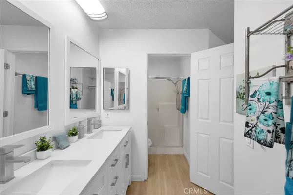 a bathroom with a double vanity sink and mirror