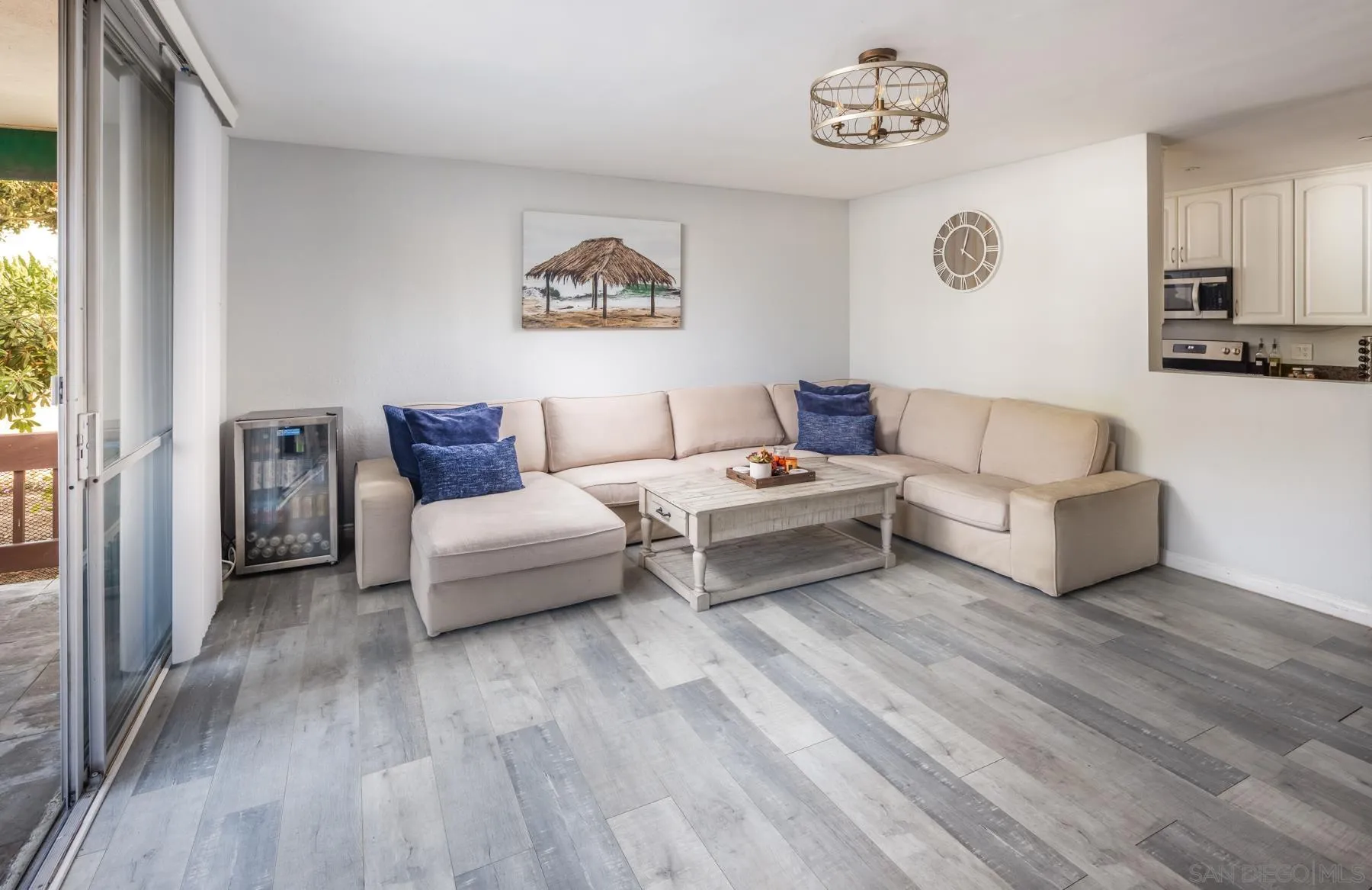 6333 La Jolla Boulevard, Unit 170 La Jolla, CA 92037 - Photo 5 of 18 a living room with furniture and a wooden floor