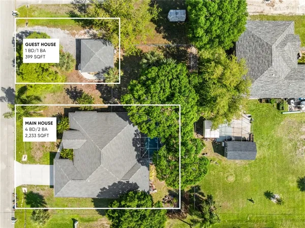 an aerial view of residential house with outdoor space and swimming pool