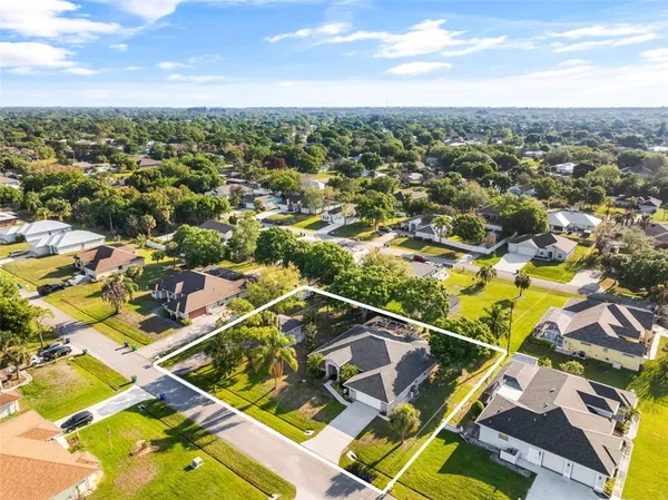 an aerial view of residential building with swimming pool