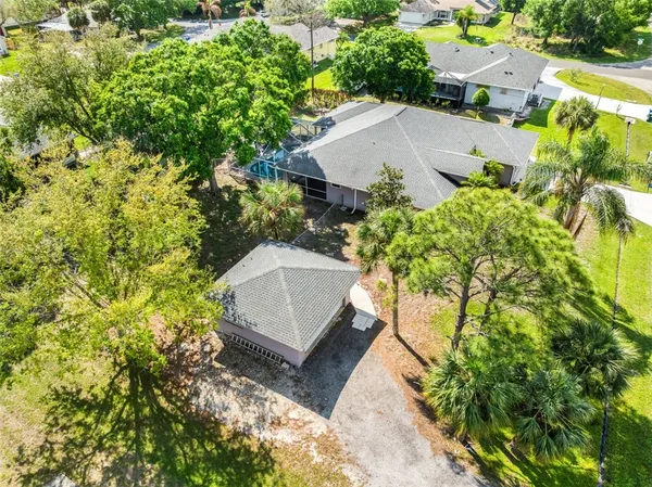 an aerial view of a house with a yard