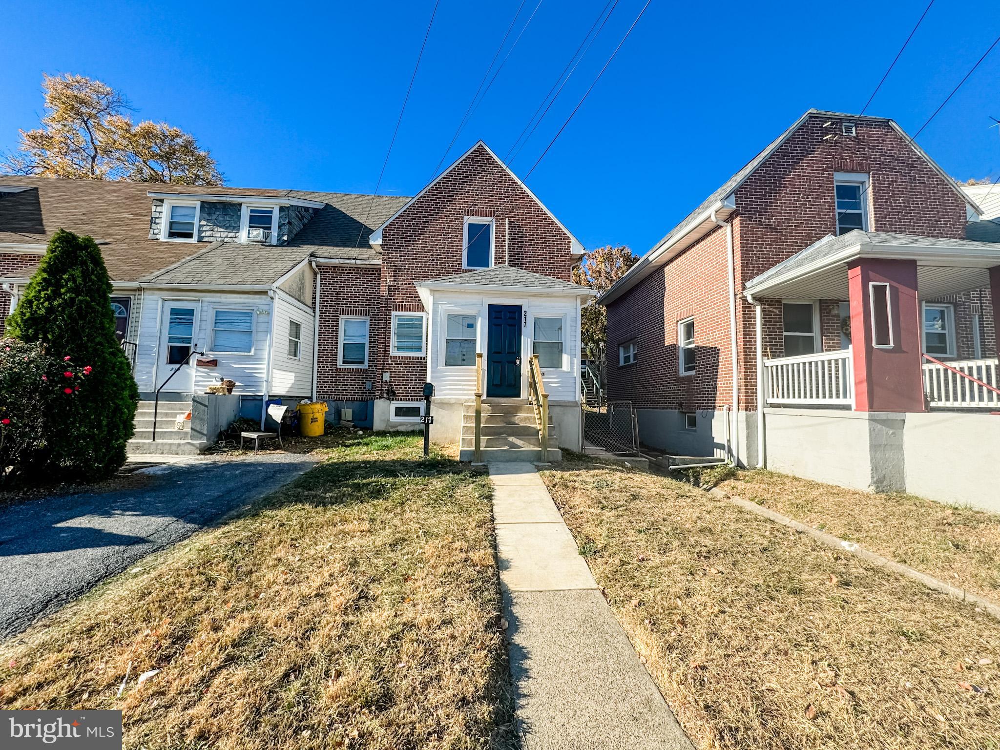 217 Ridge Road Claymont, DE 19703 - Photo 1 of 18 a front view of a house with garden