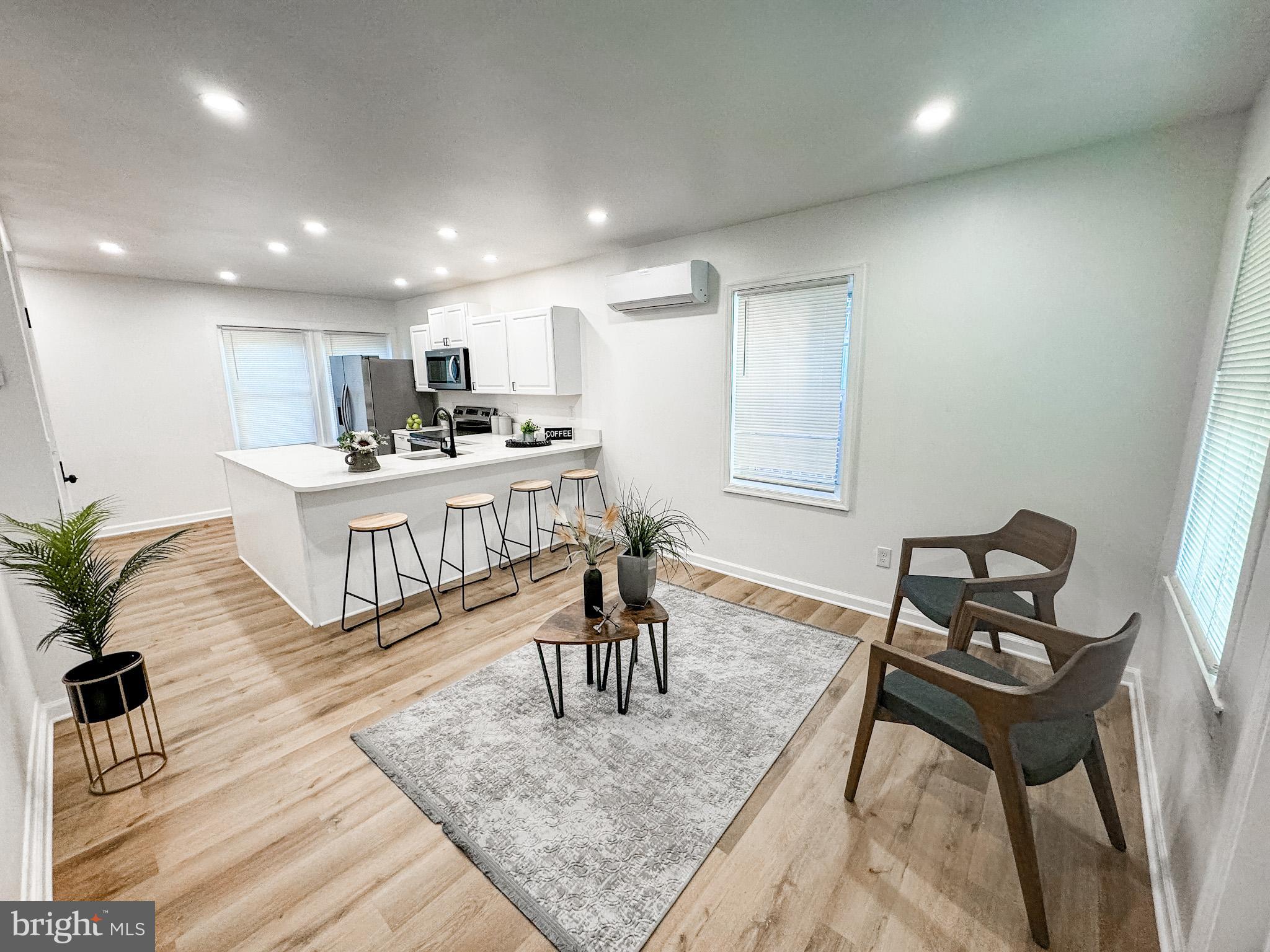 217 Ridge Road Claymont, DE 19703 - Photo 4 of 18 a living room with furniture and a wooden floor