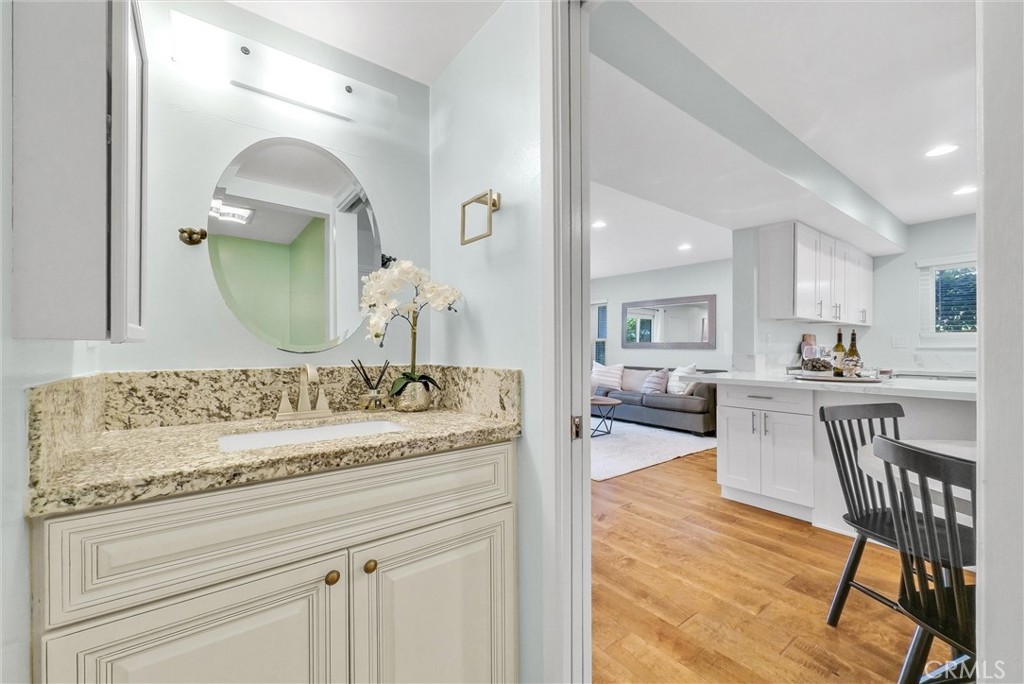 1528 North Gilbert Street Fullerton, CA 92833 - Photo 16 of 40 a en suite bathroom with a granite countertop sink and a mirror